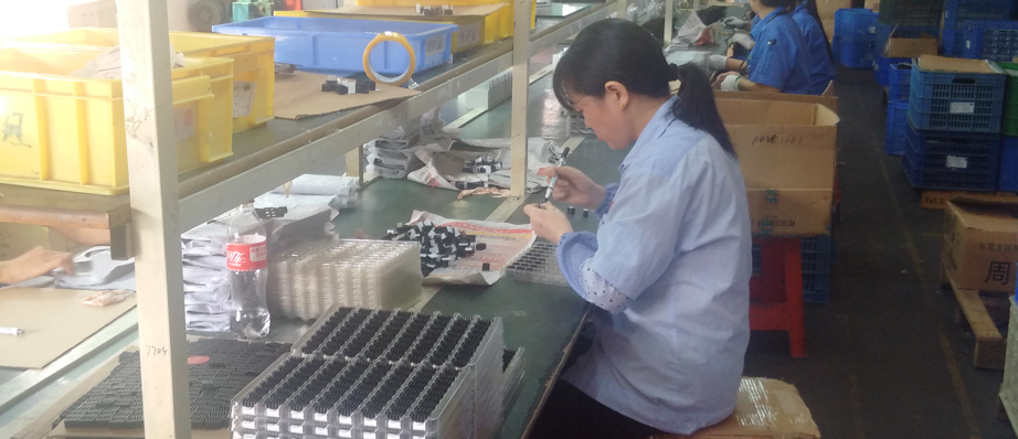 A shanzhai worker in Huaqiangbei, busy making knock-off products A worker in Huaqiangbei, busy making shanzhai phones